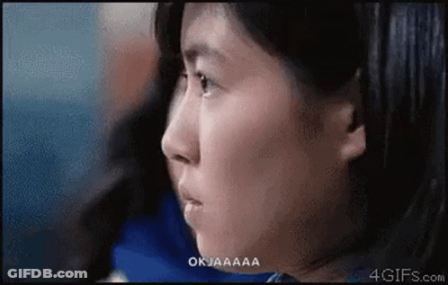 A Close Up Of A Woman 'S Face With The Words Okjaaaa Above Her GIF
