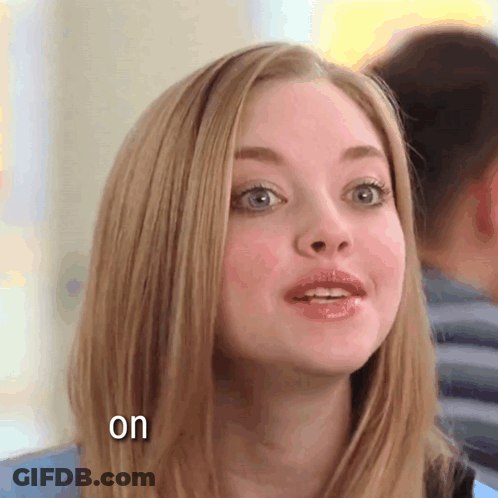 A Close Up Of A Woman 'S Face With The Words " On " Below Her GIF