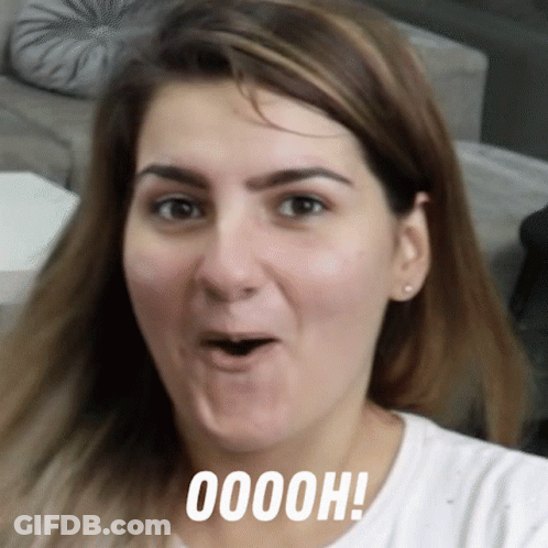 A Close Up Of A Woman 'S Face With The Words Ooooh Written Below Her GIF