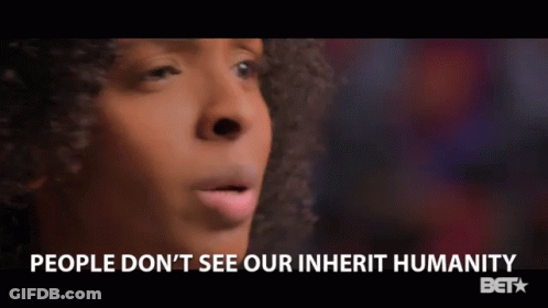 A Close Up Of A Woman 'S Face With The Words People Do N't See Our Inherit Humanity Below Her GIF