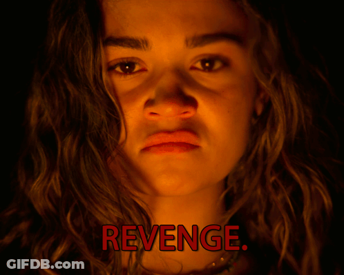 A Close Up Of A Woman 'S Face With The Words Revenge Written Above Her GIF