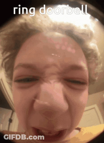 A Close Up Of A Woman 'S Face With The Words Ring Doorbell Written Above Her GIF