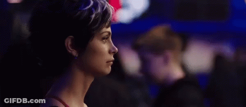 A Close Up Of A Woman 'S Face With The Words Ruh-Roh In Red GIF