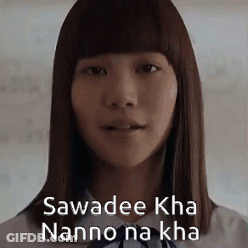 A Close Up Of A Woman 'S Face With The Words Sawadee Kha Nanno Na Kha Written On Her Face . GIF
