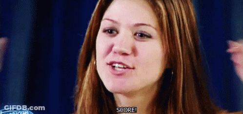 A Close Up Of A Woman 'S Face With The Words Score Visible GIF