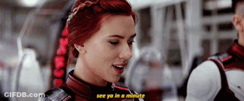 A Close Up Of A Woman 'S Face With The Words `` See Ya In A Minute '' Above Her . GIF