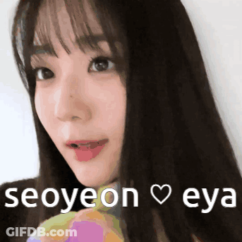 A Close Up Of A Woman 'S Face With The Words Seoyeon Eya Written Below Her GIF