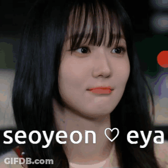 A Close Up Of A Woman 'S Face With The Words Seoyeon Eya Written On The Bottom GIF