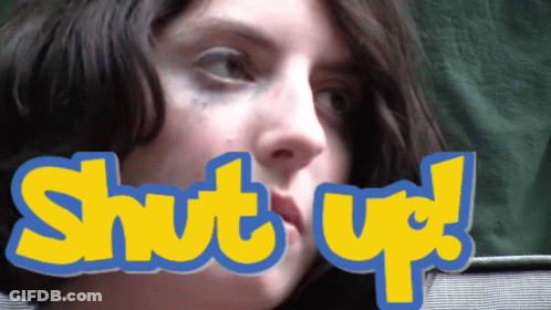 A Close Up Of A Woman 'S Face With The Words Shut Up Above Her Mouth GIF