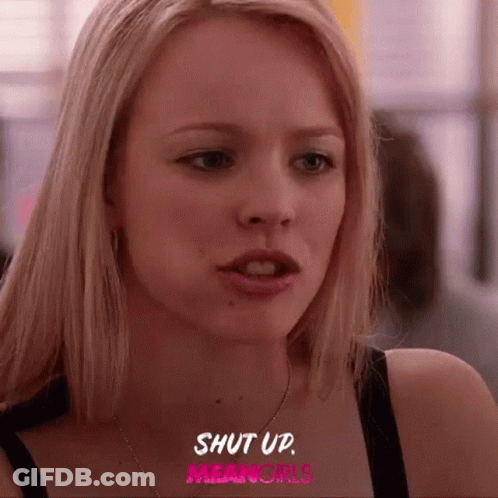 A Close Up Of A Woman 'S Face With The Words `` Shut Up Mean Girls '' Written On The Bottom . GIF