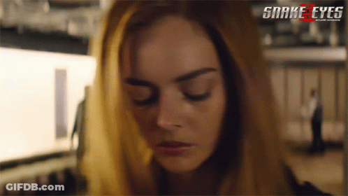 A Close Up Of A Woman 'S Face With The Words Snake Eyes On The Bottom Right GIF