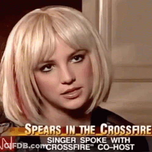 A Close Up Of A Woman 'S Face With The Words Spears In The Crossfire Singer Spoke With " Crossfire " Co-Host GIF
