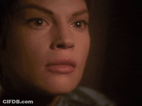 A Close Up Of A Woman 'S Face With The Words " Stop Talking " Below Her GIF