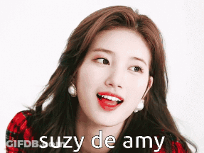 A Close Up Of A Woman 'S Face With The Words Suzy De Amy Written Below Her GIF