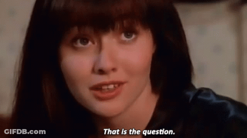 A Close Up Of A Woman 'S Face With The Words That Is The Question Below Her GIF