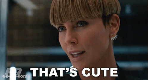 A Close Up Of A Woman 'S Face With The Words That 'S Cute Behind Her GIF