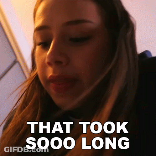 A Close Up Of A Woman 'S Face With The Words That Took Sooo Long Behind Her GIF