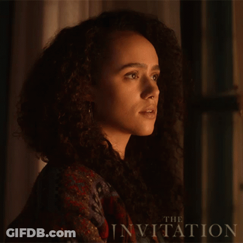 A Close Up Of A Woman 'S Face With The Words " The Invitation " Behind Her GIF