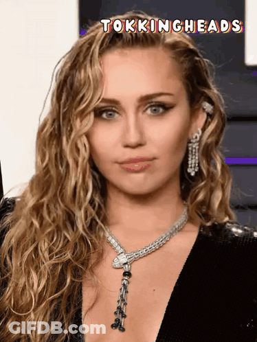 A Close Up Of A Woman 'S Face With The Words Tockingheads Above It GIF