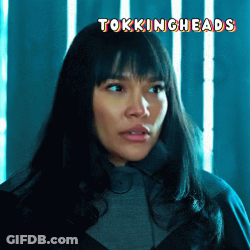 A Close Up Of A Woman 'S Face With The Words " Tokingheads " Above Her GIF