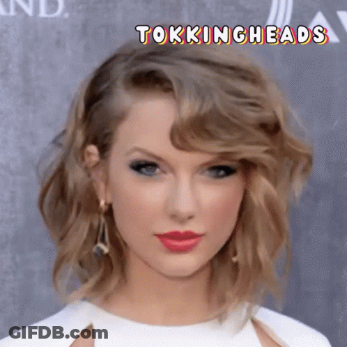 A Close Up Of A Woman 'S Face With The Words Tokingheads Below Her GIF