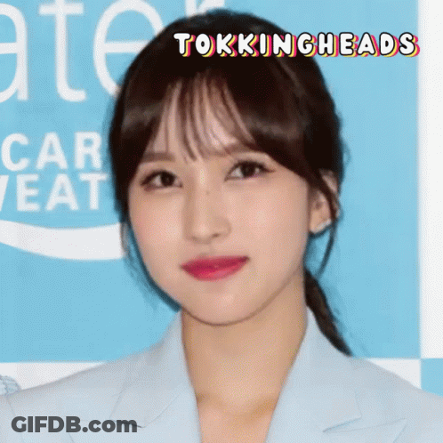 A Close Up Of A Woman 'S Face With The Words Tokingheads Written Above Her GIF