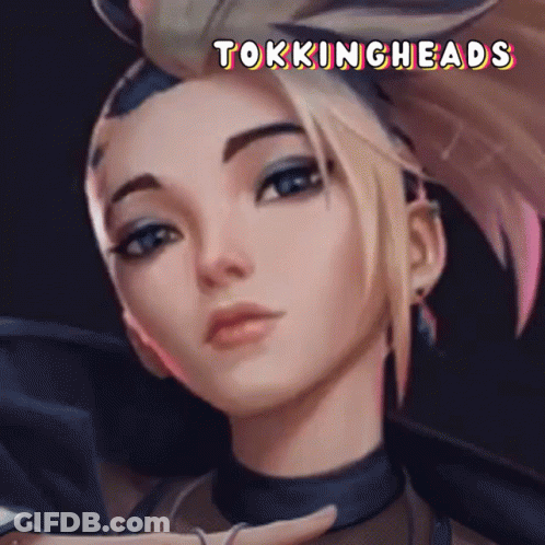 A Close Up Of A Woman 'S Face With The Words Tokingheads Written Above Her GIF
