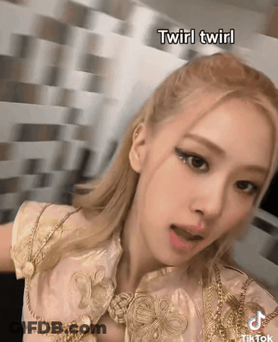 A Close Up Of A Woman 'S Face With The Words Twirl Twirl Below Her GIF