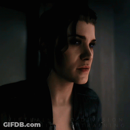 A Close Up Of A Woman 'S Face With The Words Virtual Reality Division Mischief Training Written On The Bottom GIF