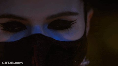 A Close Up Of A Woman 'S Face With The Words Watches You Burn GIF