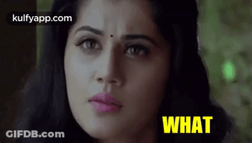 A Close Up Of A Woman 'S Face With The Words `` What '' Written In Yellow . GIF