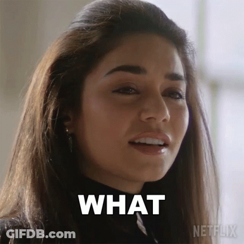 A Close Up Of A Woman 'S Face With The Words What Written On Her Face GIF