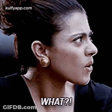 A Close Up Of A Woman 'S Face With The Words `` What '' Written On It . GIF
