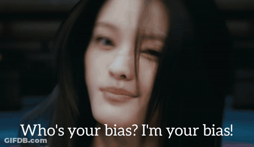 A Close Up Of A Woman 'S Face With The Words Who 'S Your Bias I 'M Your Bias Below Her GIF