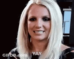 A Close Up Of A Woman 'S Face With The Words `` Yay '' Written On It . GIF