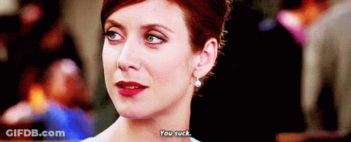 Close Up Of Woman's Face With You Suck Text GIF