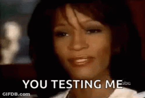 A Close Up Of A Woman 'S Face With The Words `` You Testing Me '' On It . GIF