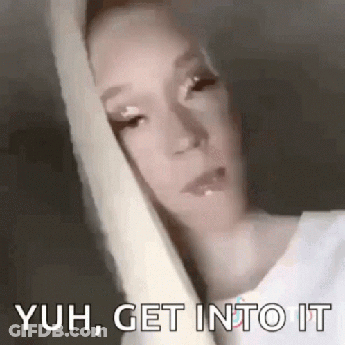 A Close Up Of A Woman 'S Face With The Words `` Yuh , Get Into It '' Written On The Bottom . GIF