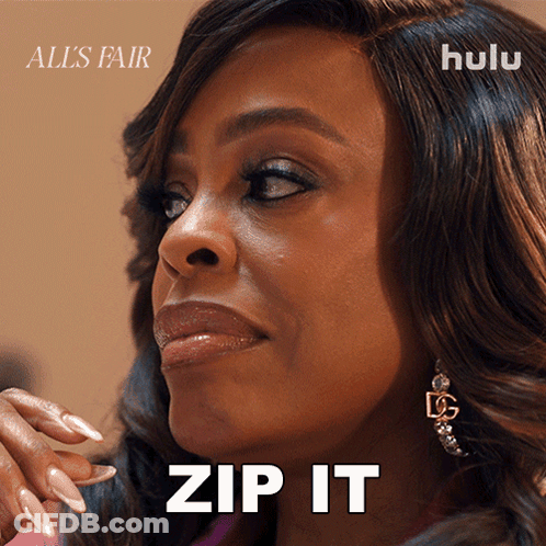 A Close Up Of A Woman 'S Face With The Words Zip It GIF
