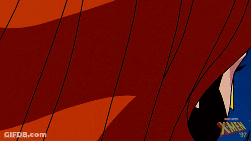 A Close Up Of A Woman 'S Face With The X-Men Logo On The Bottom Right GIF