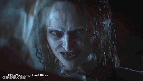 A Close Up Of A Woman 'S Face With #Theconjuring Last Rites Written Below It GIF