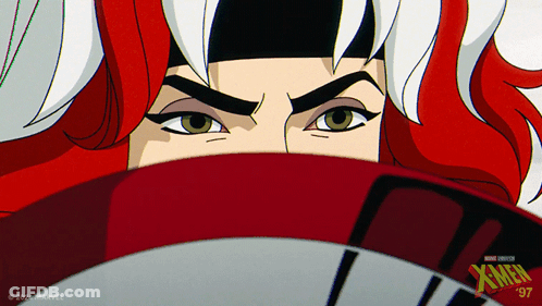 A Close Up Of A Woman 'S Face With Xmen Written On The Bottom Right GIF