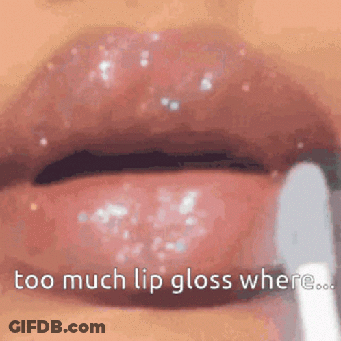 A Close Up Of A Woman 'S Lips With Lip Gloss Being Applied . GIF