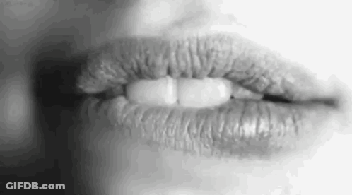 A Close Up Of A Woman 'S Lips With Lipstick On Them . GIF