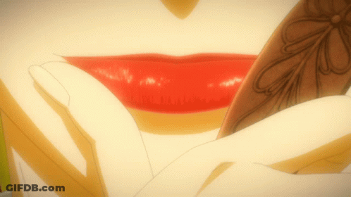 A Close Up Of A Woman 'S Lips With Red Lipstick And A Flower Design GIF