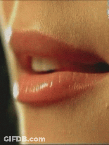 A Close Up Of A Woman 'S Lips With Red Lipstick On GIF