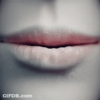 A Close Up Of A Woman 'S Lips With Red Lipstick On GIF
