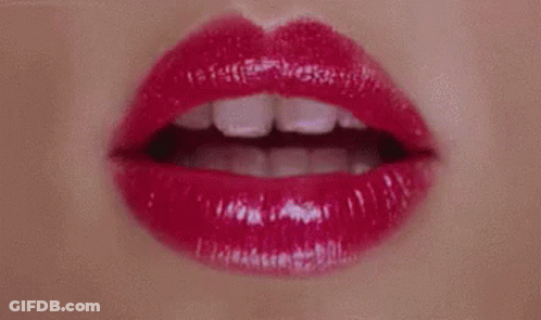 A Close Up Of A Woman 'S Lips With Red Lipstick On . GIF