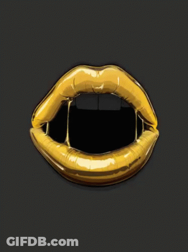 A Close Up Of A Woman 'S Mouth With Gold Lips GIF
