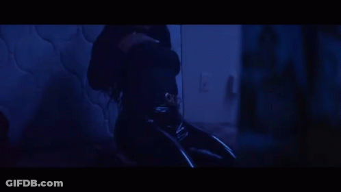 A Close Up Of A Woman 'S Mouth With Two Razor Blades In It GIF
